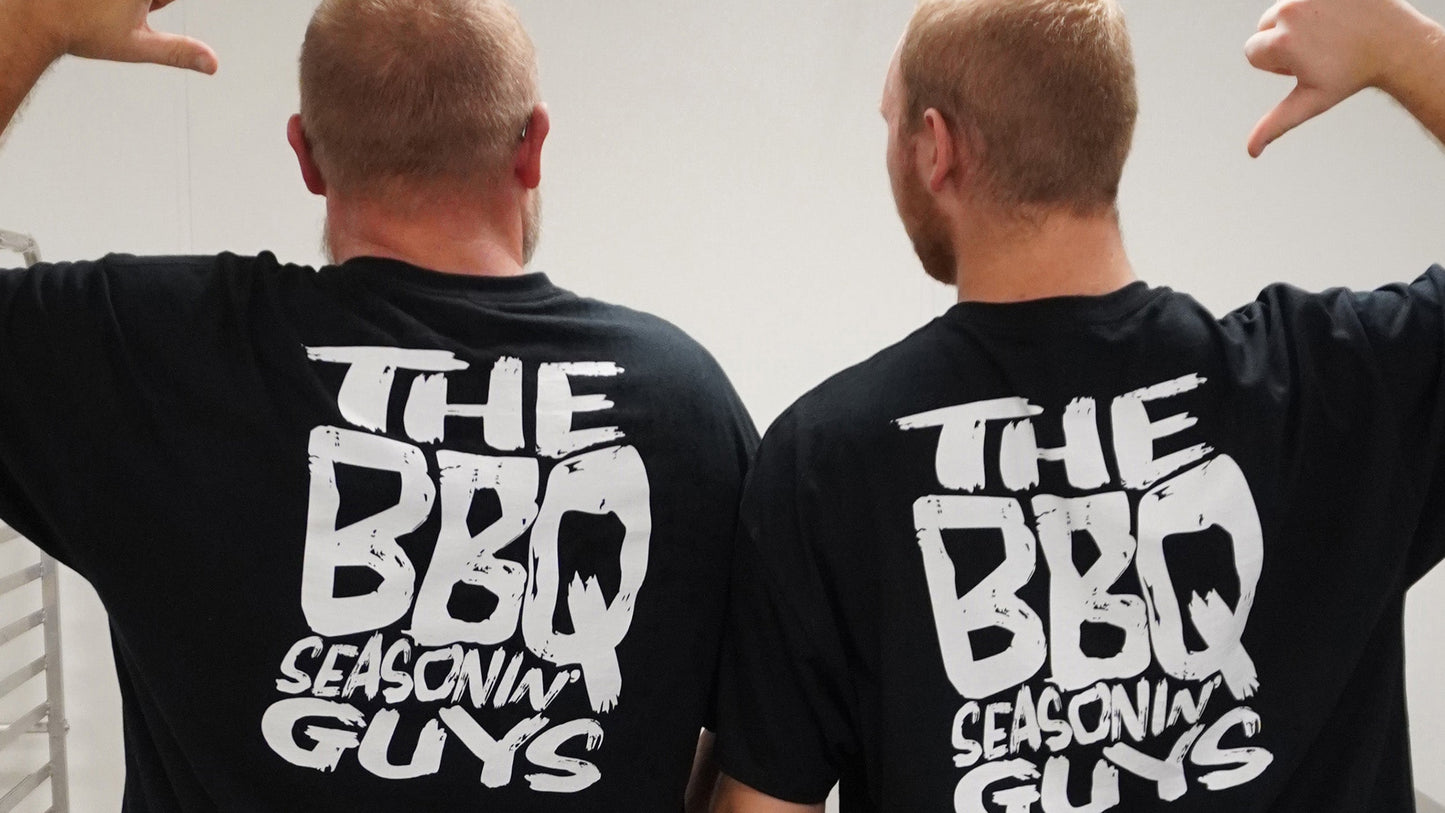 Two men wearing black t-shirts with 'The BBQ Seasonin' Guys' text on the back.